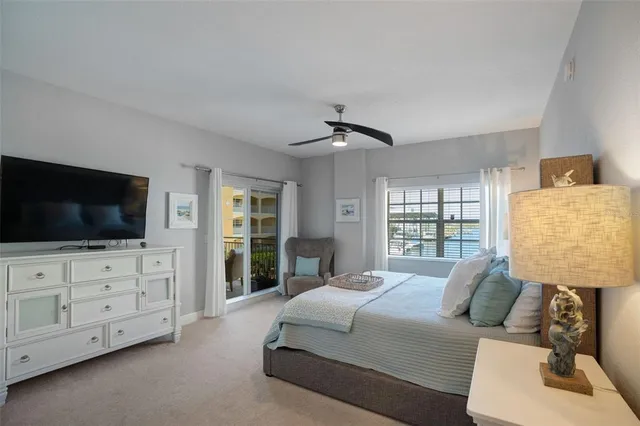 a bedroom with a bed and flat screen tv