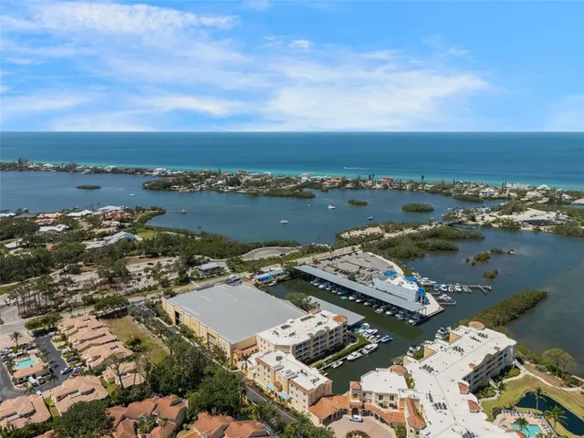 an aerial view of a city with ocean view