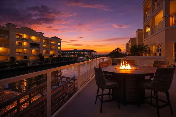 a view of a balcony with outdoor seating