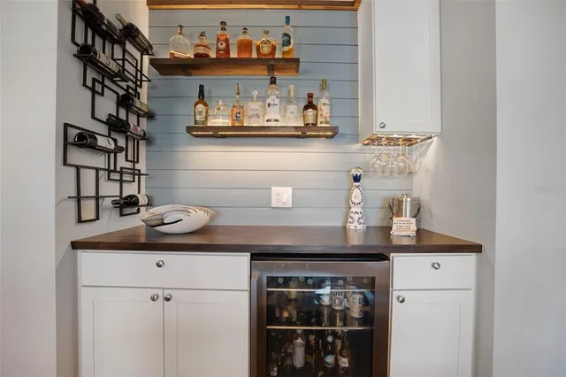 a kitchen with a refrigerator and cabinets