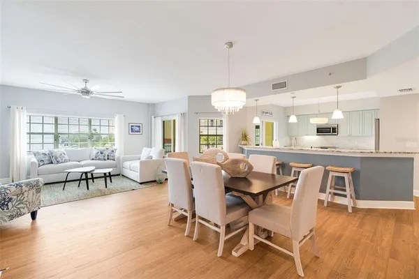 a dining room with furniture and wooden floor