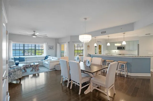 a dining room with furniture window and wooden floor
