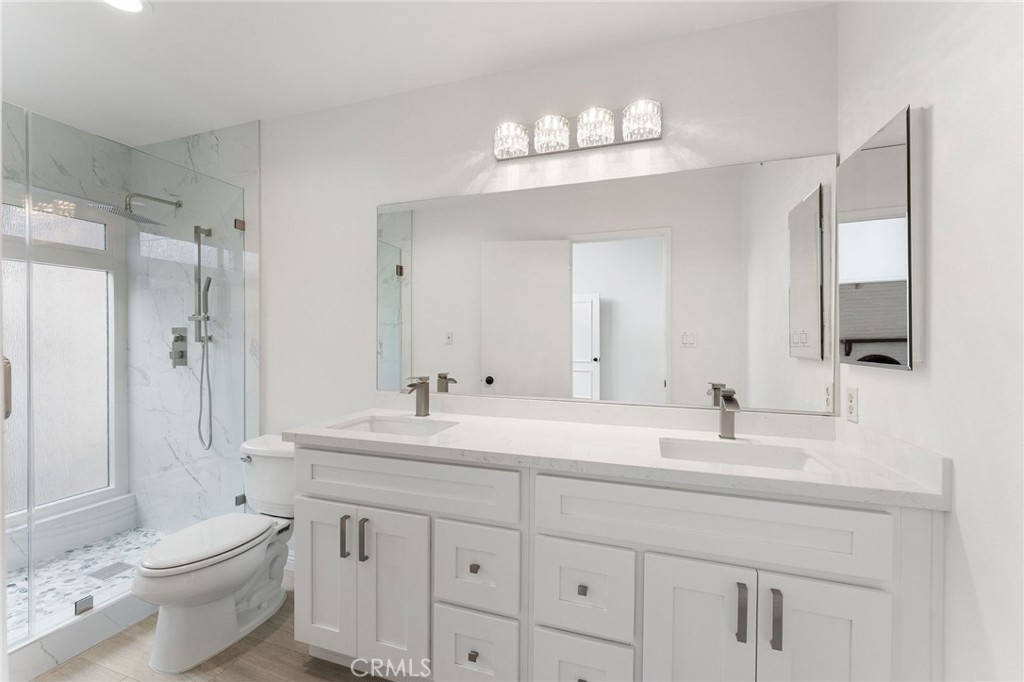 46 Cedar Tree Lane Irvine, CA 92612 - Photo 14 of 44 a bathroom with a double vanity sink mirror and toilet