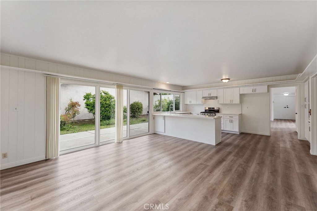 46 Cedar Tree Lane Irvine, CA 92612 - Photo 16 of 44 a view of a kitchen with wooden floor and electronic appliances