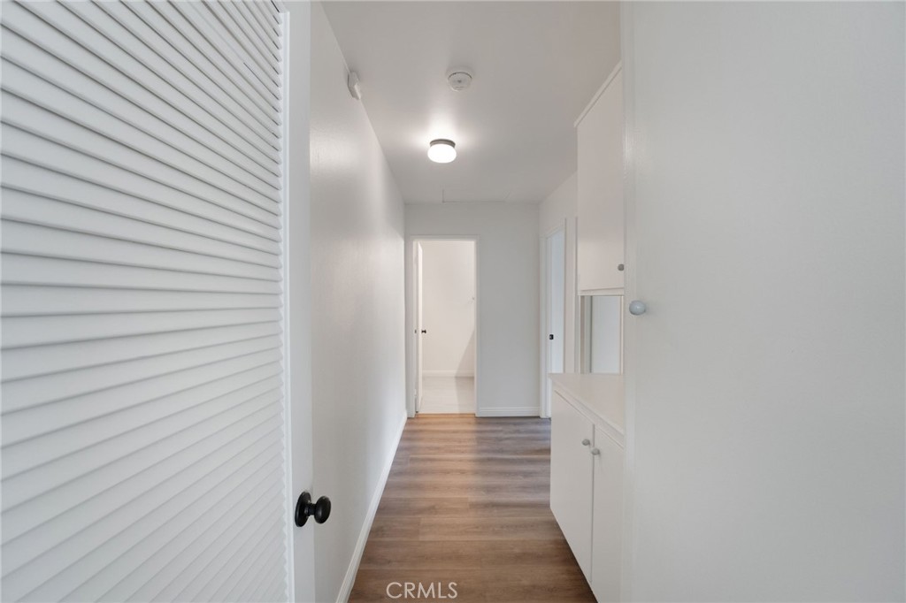 46 Cedar Tree Lane Irvine, CA 92612 - Photo 19 of 44 a view of a hallway with wooden floor