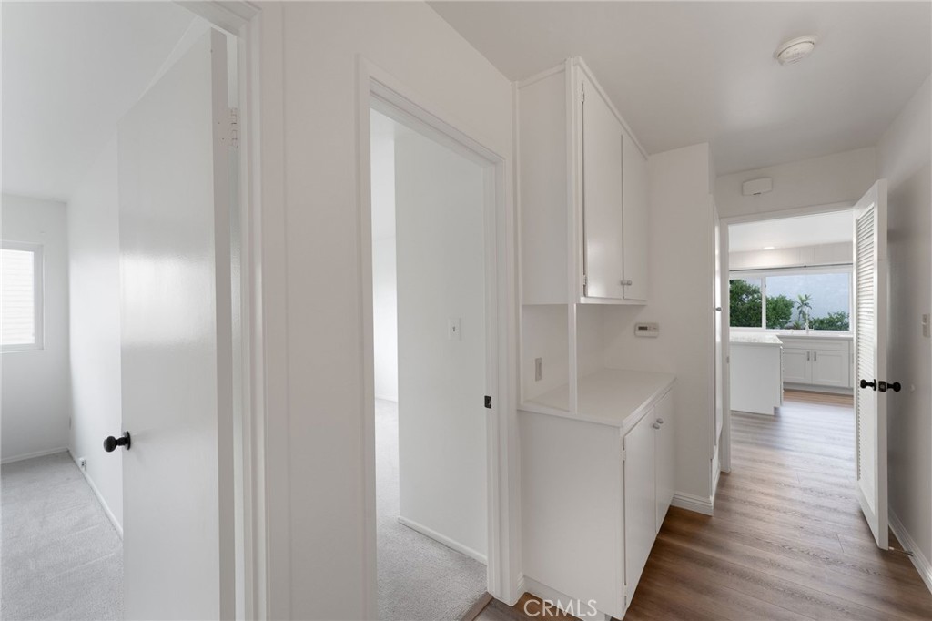 46 Cedar Tree Lane Irvine, CA 92612 - Photo 20 of 44 a view of a hallway with wooden floor