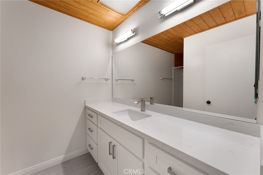 46 Cedar Tree Lane Irvine, CA 92612 - Photo 25 of 44 a bathroom with a sink and a mirror