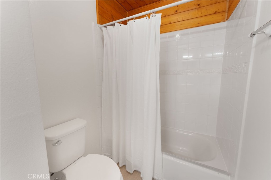 46 Cedar Tree Lane Irvine, CA 92612 - Photo 26 of 44 a white toilet sitting next to a bath tub