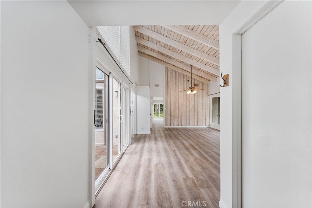 46 Cedar Tree Lane Irvine, CA 92612 - Photo 6 of 44 a view of a hallway with wooden floor and entryway
