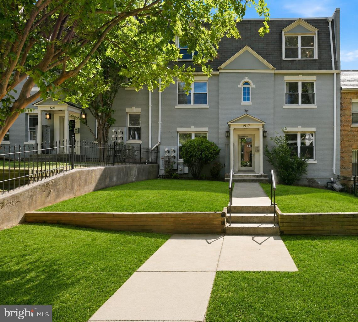 1917 2nd Street Northeast, Unit 301 Washington, DC 20002 - Photo 1 of 20 a front view of a house with a yard
