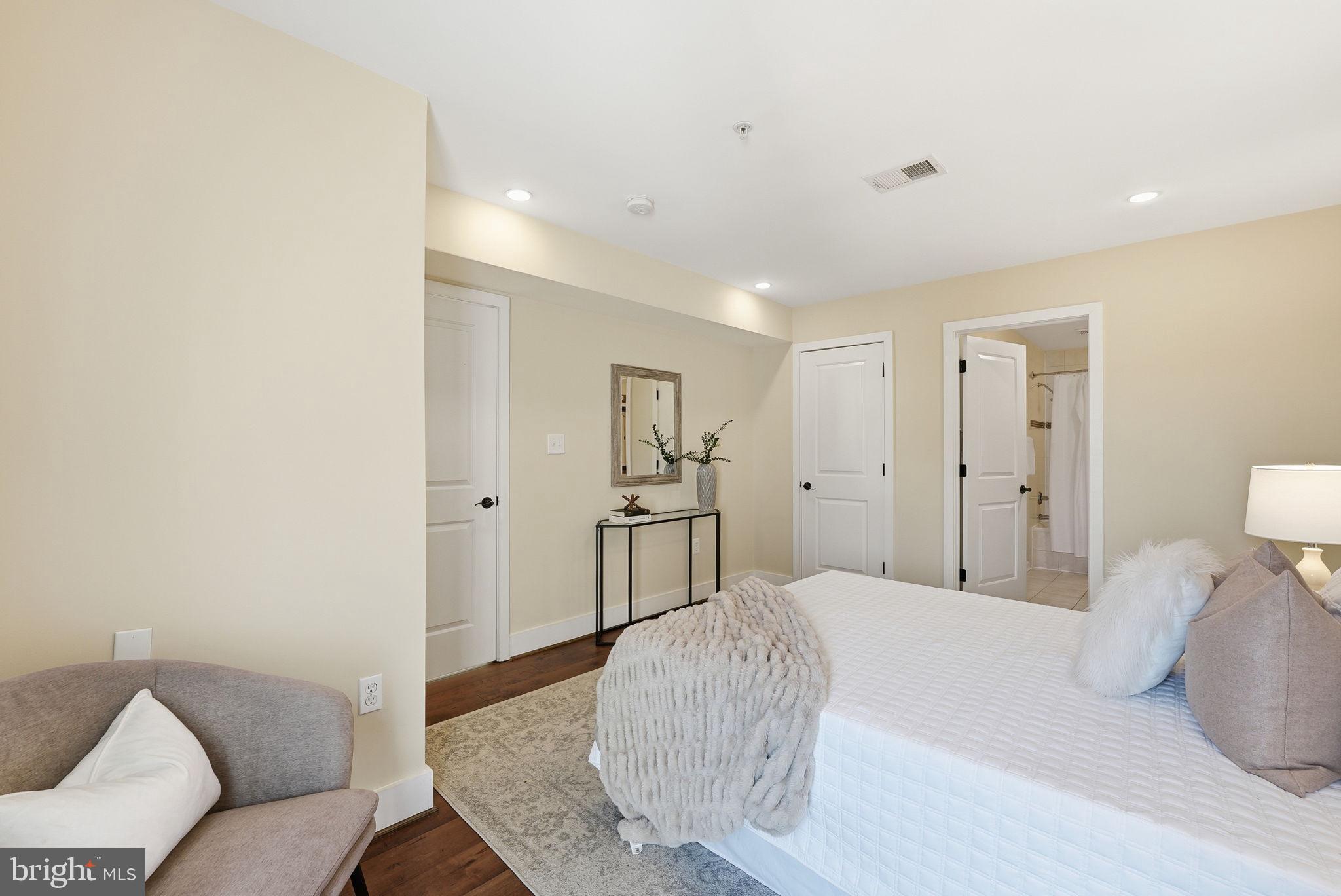 1917 2nd Street Northeast, Unit 301 Washington, DC 20002 - Photo 12 of 20 a spacious bedroom with a bed and a couch