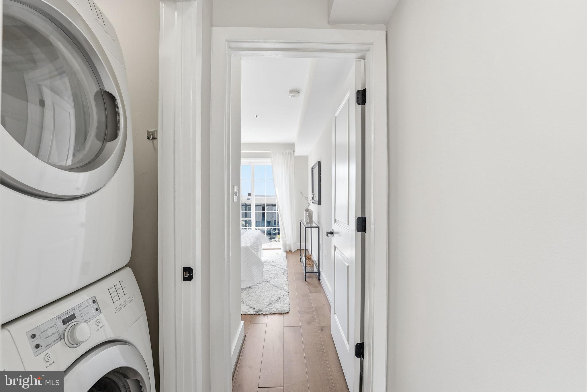 1917 2nd Street Northeast, Unit 301 Washington, DC 20002 - Photo 15 of 20 a view of a hallway with a washer and dryer
