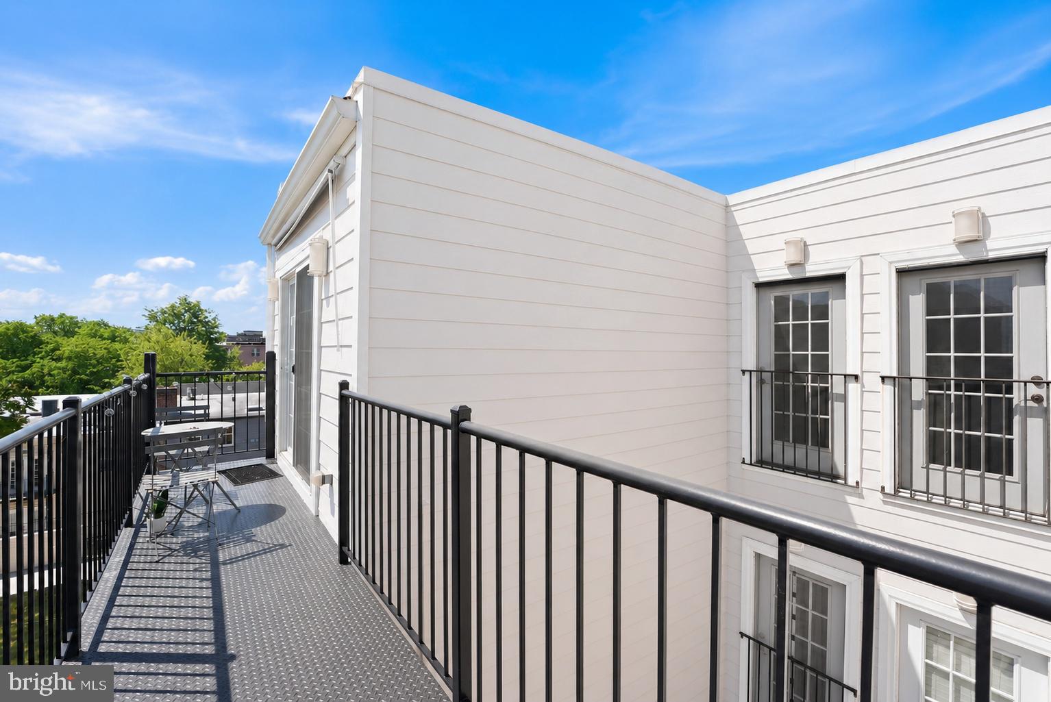 1917 2nd Street Northeast, Unit 301 Washington, DC 20002 - Photo 19 of 20 a view of a balcony with wooden floor and fence