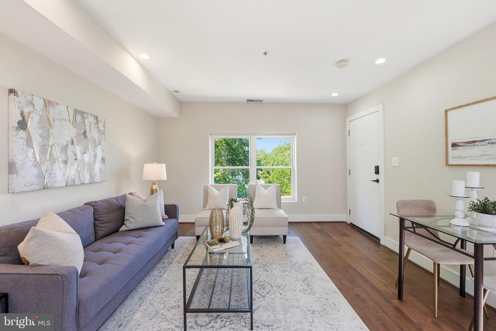 1917 2nd Street Northeast, Unit 301 Washington, DC 20002 - Photo 8 of 20 a living room with furniture and a window