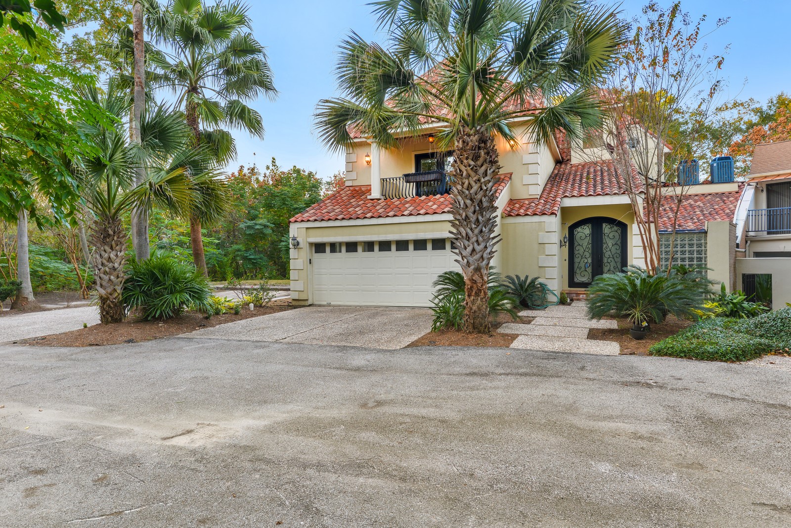 15 West Shady Lane, Unit B Houston, TX 77063 - Photo 1 of 18 a front view of a house with yard and trees