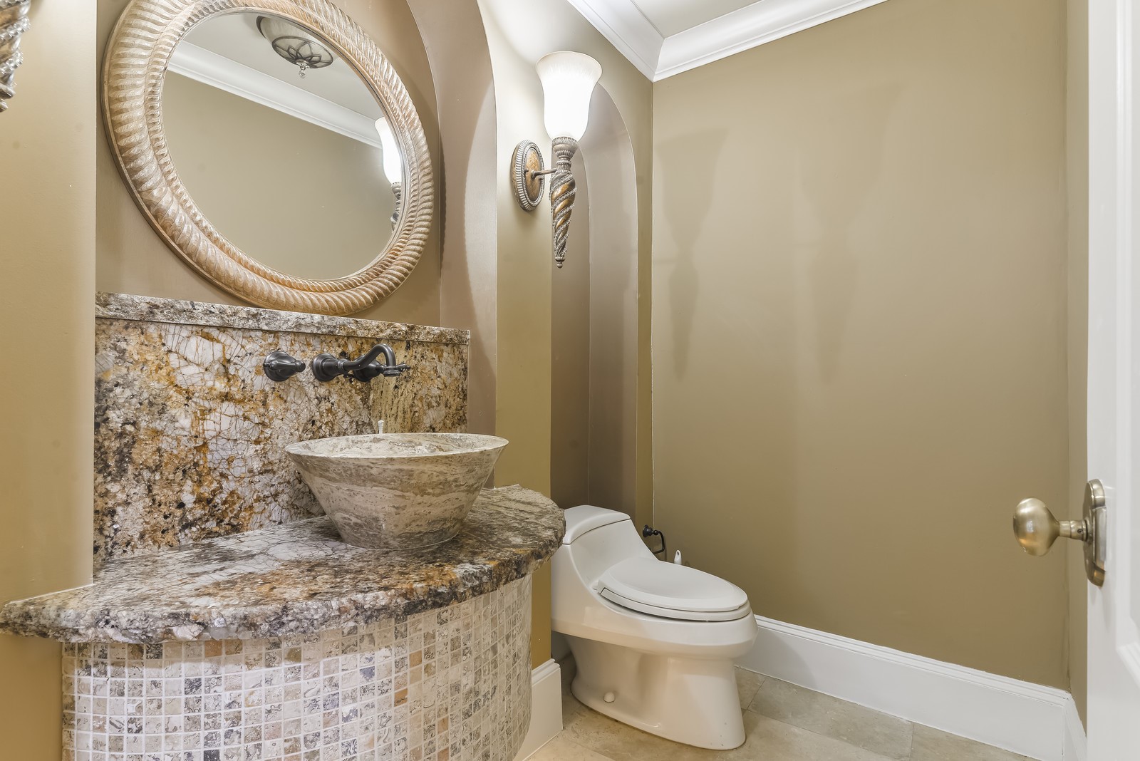 15 West Shady Lane, Unit B Houston, TX 77063 - Photo 17 of 18 a bathroom with a granite countertop toilet a sink and a mirror