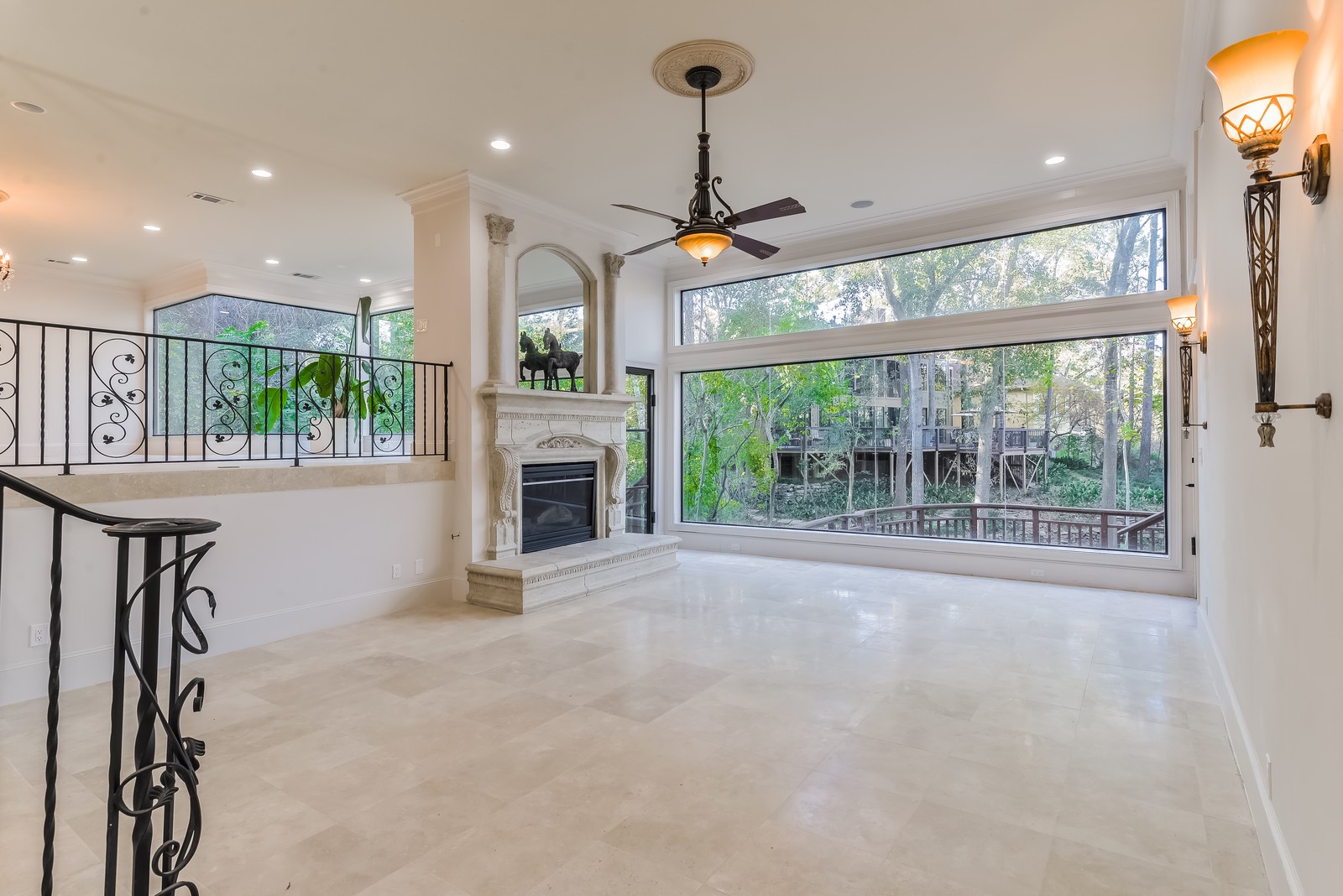 15 West Shady Lane, Unit B Houston, TX 77063 - Photo 4 of 18 a view of an empty room with a fireplace and a window