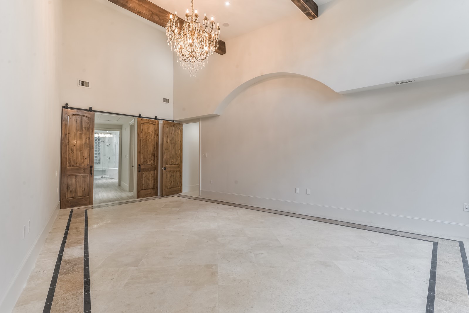 15 West Shady Lane, Unit B Houston, TX 77063 - Photo 10 of 18 a view of an empty room with a chandelier