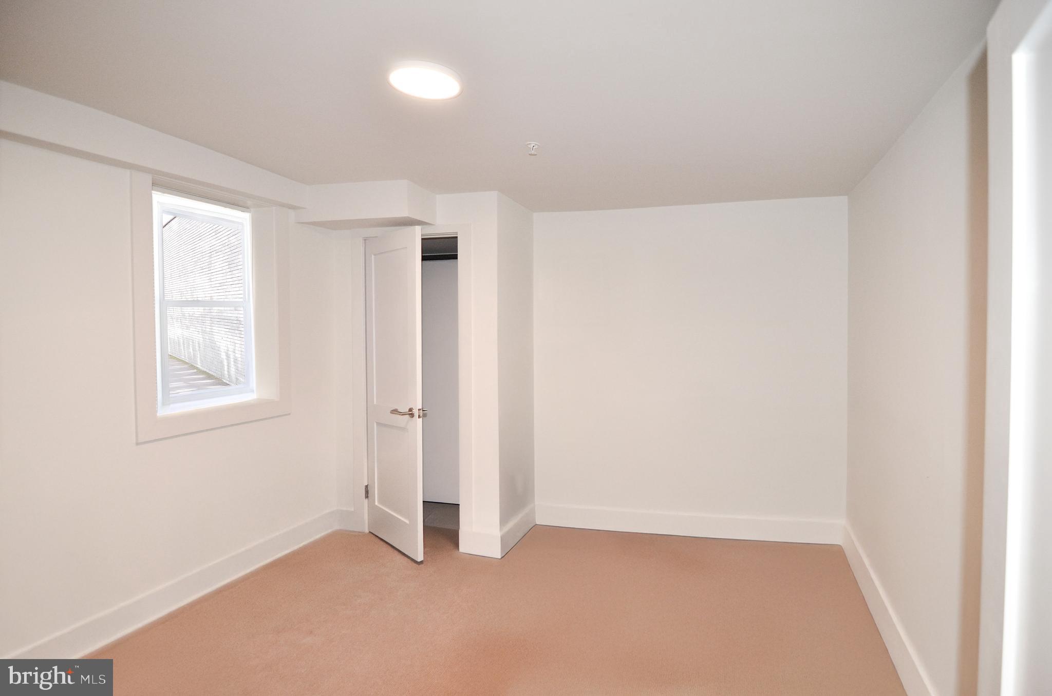 1072 Thomas Jefferson Street Northwest Washington, DC 20007 - Photo 10 of 58 an empty room with windows