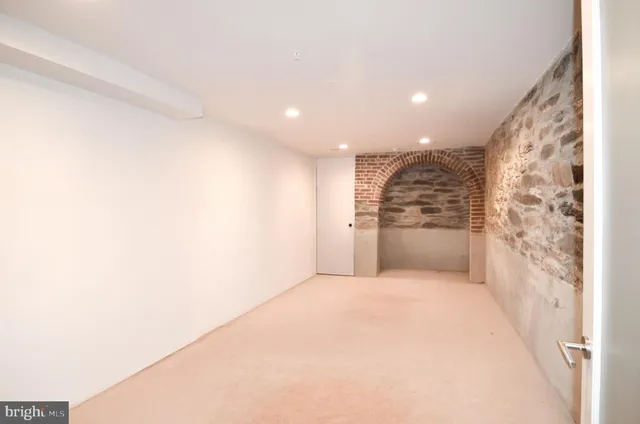 a bathroom with a bathtub and a toilet