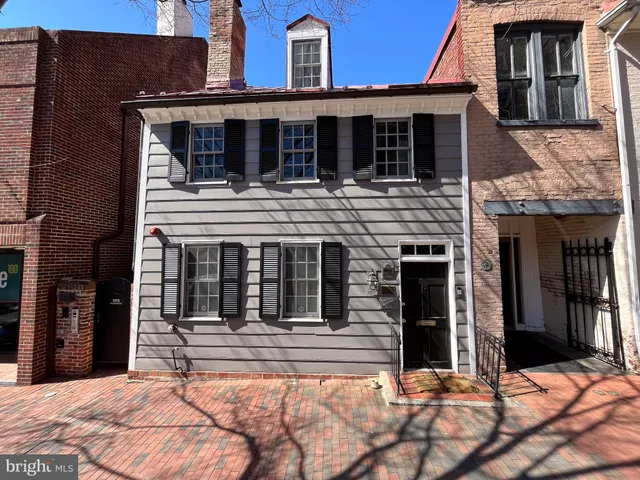 a view of staircase with white walls and window