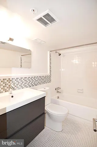 a view of a brick building with many windows