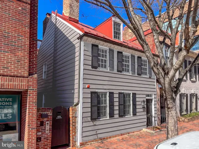 a front view of a house with a stairs
