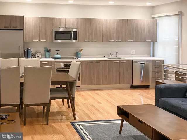 a living room with furniture and a lamp