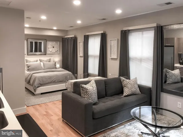 a kitchen with stainless steel appliances granite countertop a refrigerator stove and microwave