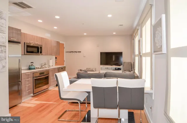 a bathroom with a sink a toilet and shower curtain