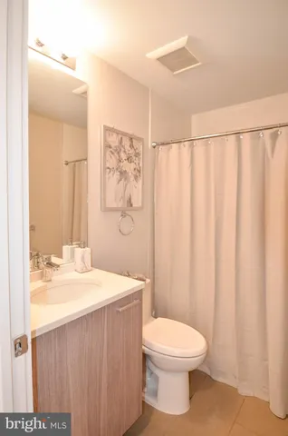 a kitchen with kitchen island sink refrigerator and window