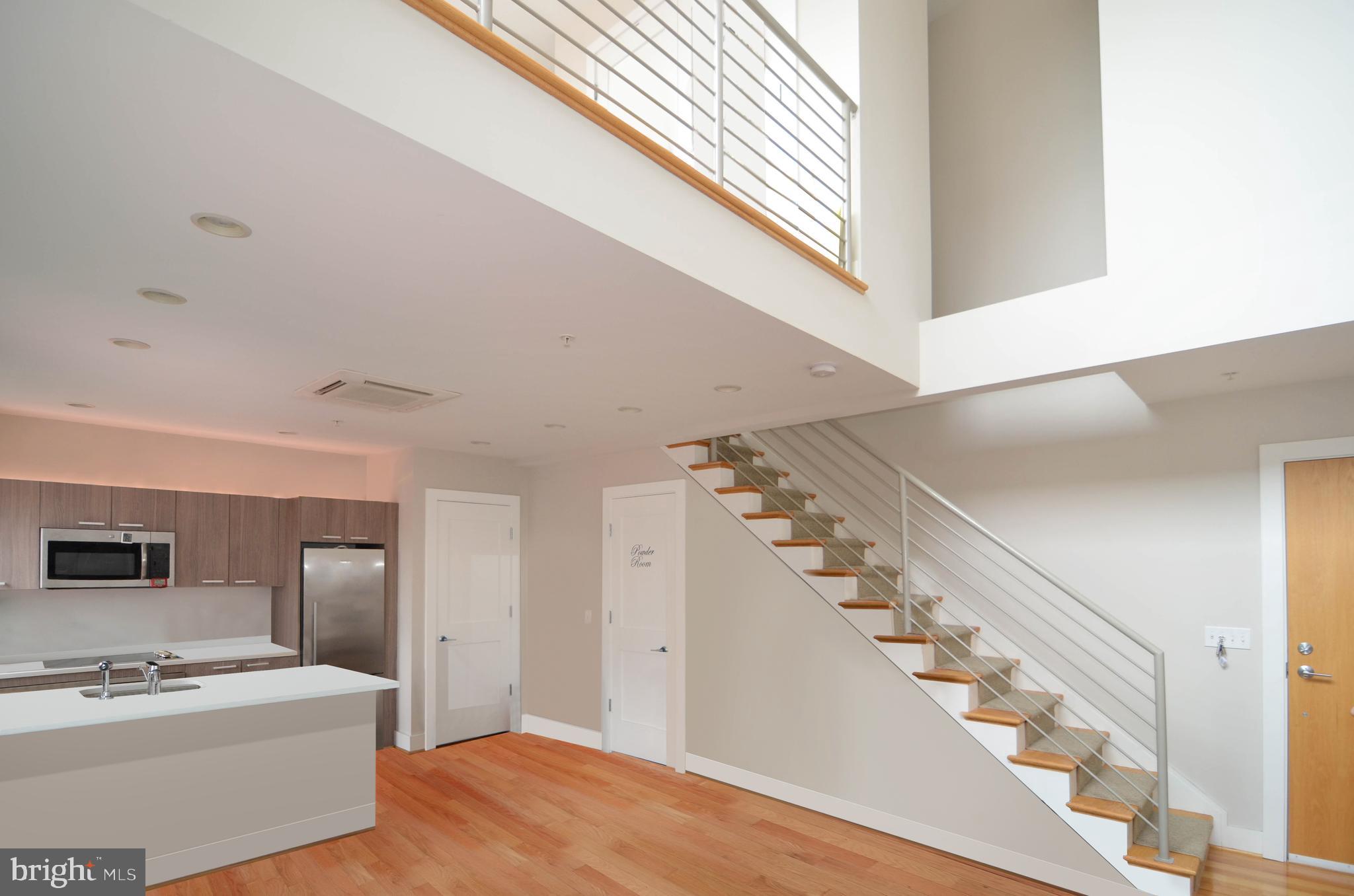 1072 Thomas Jefferson Street Northwest Washington, DC 20007 - Photo 45 of 58 a view of a hallway view with staircase and kitchen view