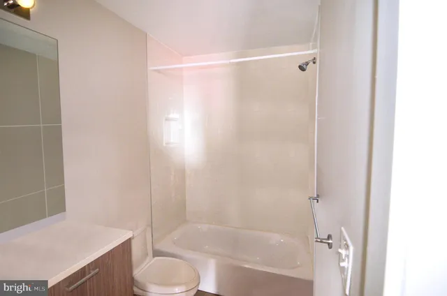 a living room with furniture kitchen and a table