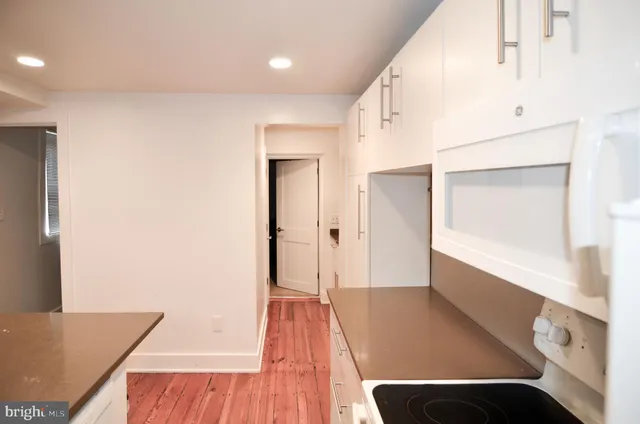 a kitchen with stainless steel appliances granite countertop a stove and a refrigerator
