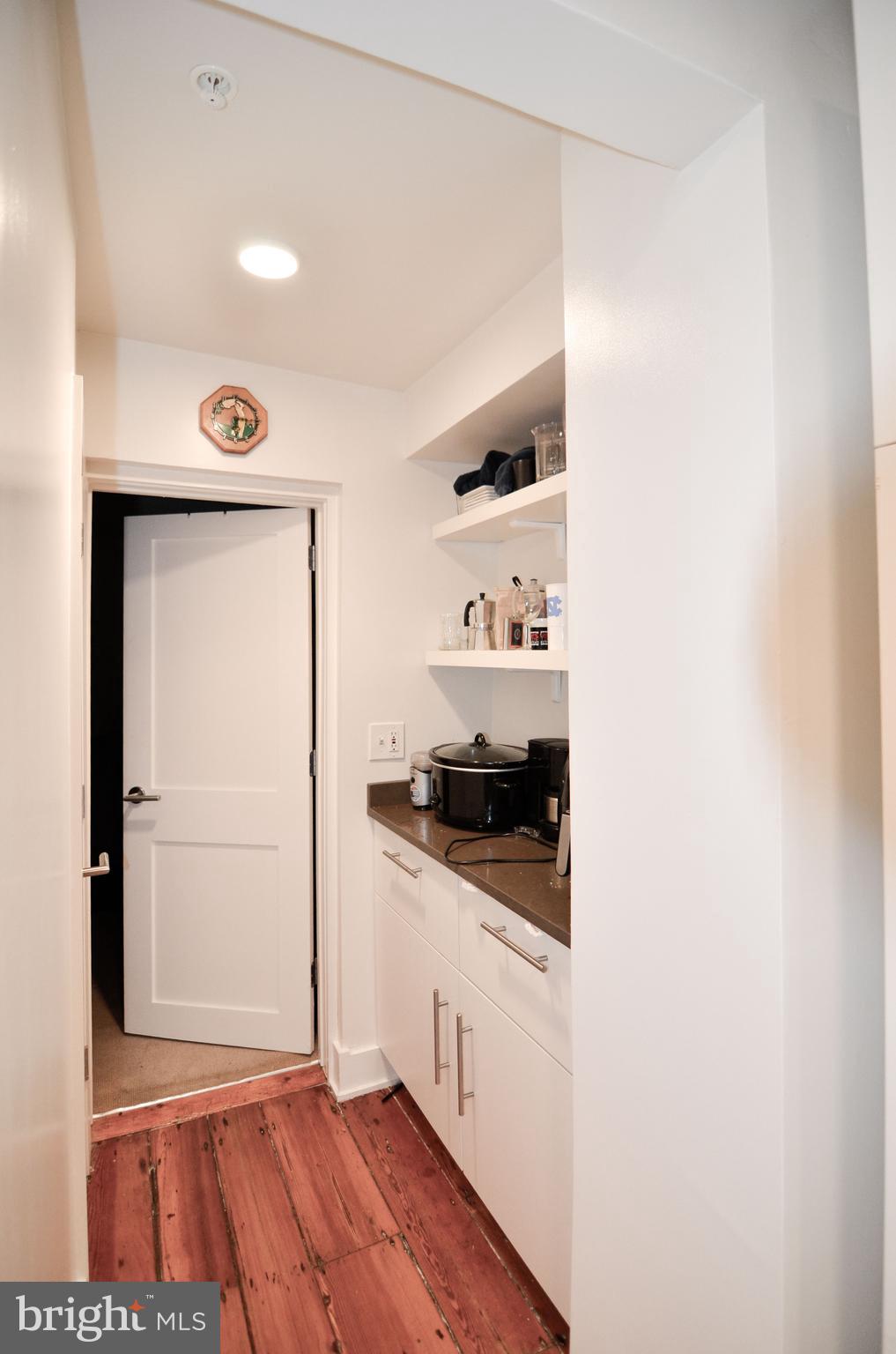 1072 Thomas Jefferson Street Northwest Washington, DC 20007 - Photo 8 of 58 a kitchen with stainless steel appliances granite countertop a stove and a refrigerator