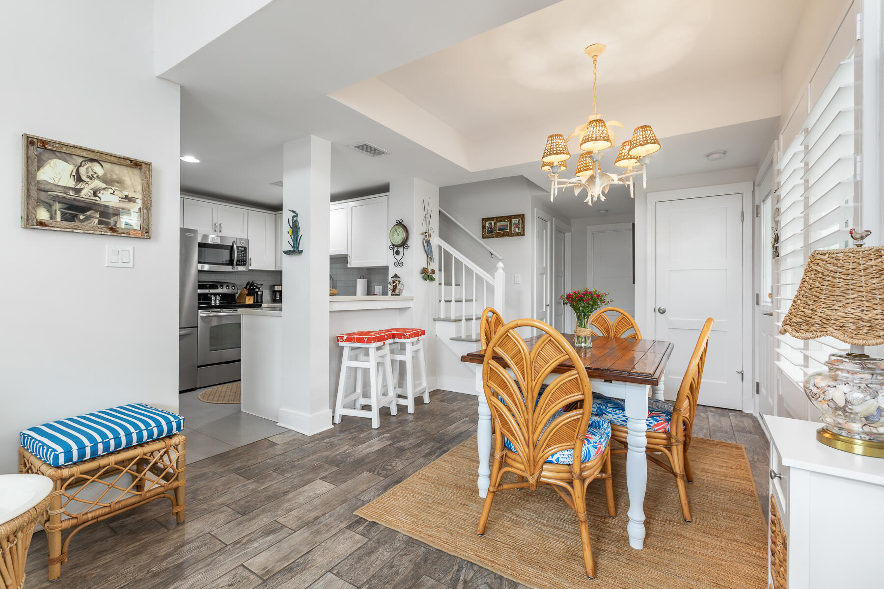 404 Porter Lane, Unit 16 Key West, FL 33040 - Photo 11 of 22 a view of a dining room with furniture and wooden floor