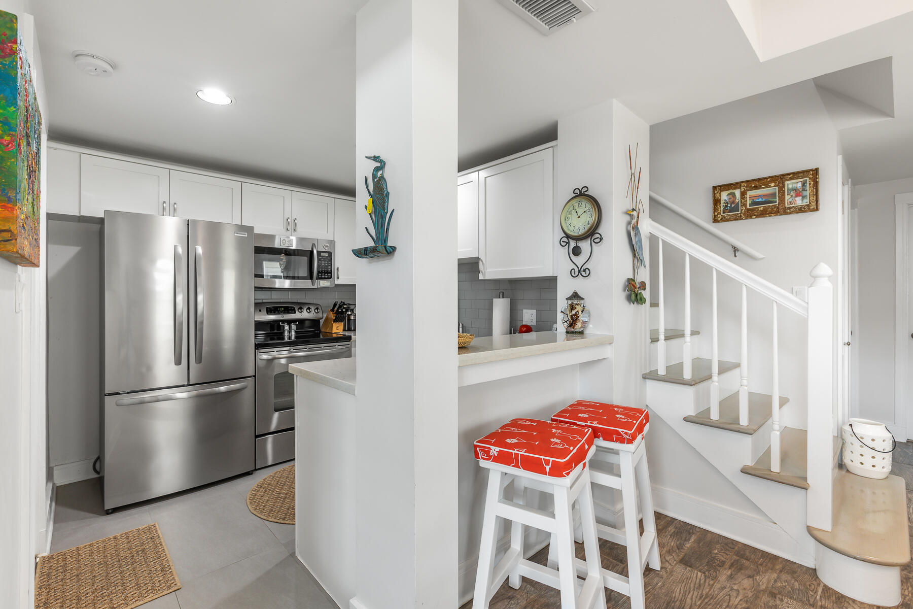404 Porter Lane, Unit 16 Key West, FL 33040 - Photo 12 of 22 a kitchen with stainless steel appliances granite countertop a refrigerator a microwave and a stove