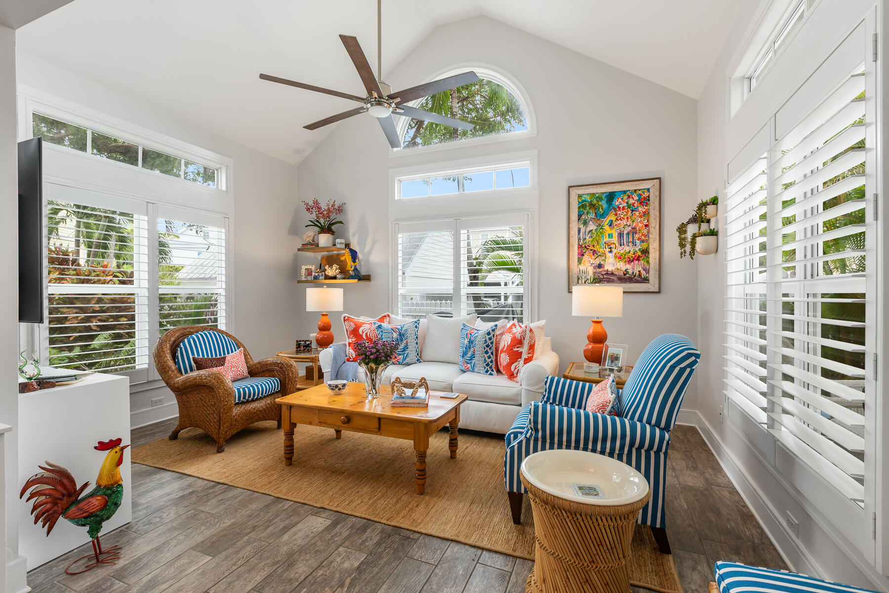 404 Porter Lane, Unit 16 Key West, FL 33040 - Photo 6 of 22 a living room with furniture a fireplace and a large window