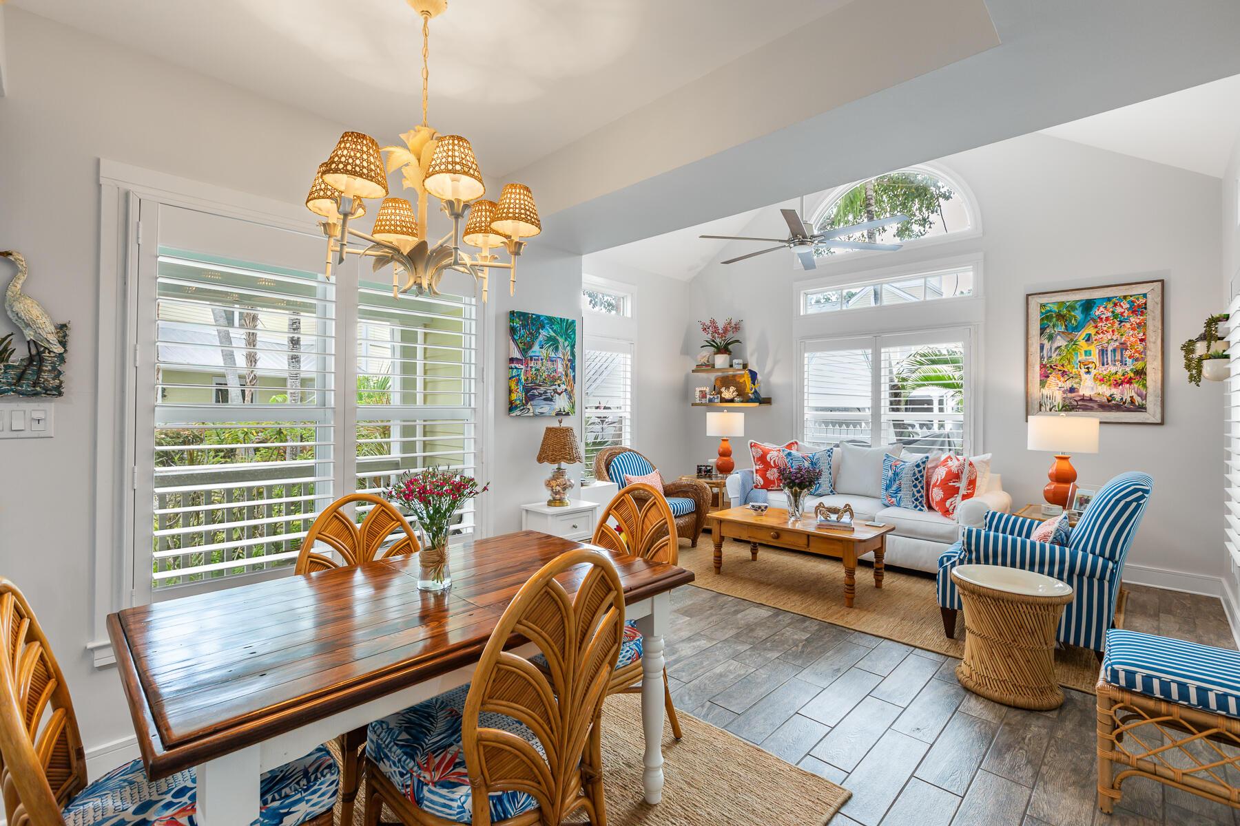 404 Porter Lane, Unit 16 Key West, FL 33040 - Photo 9 of 22 a living room with patio furniture and a chandelier