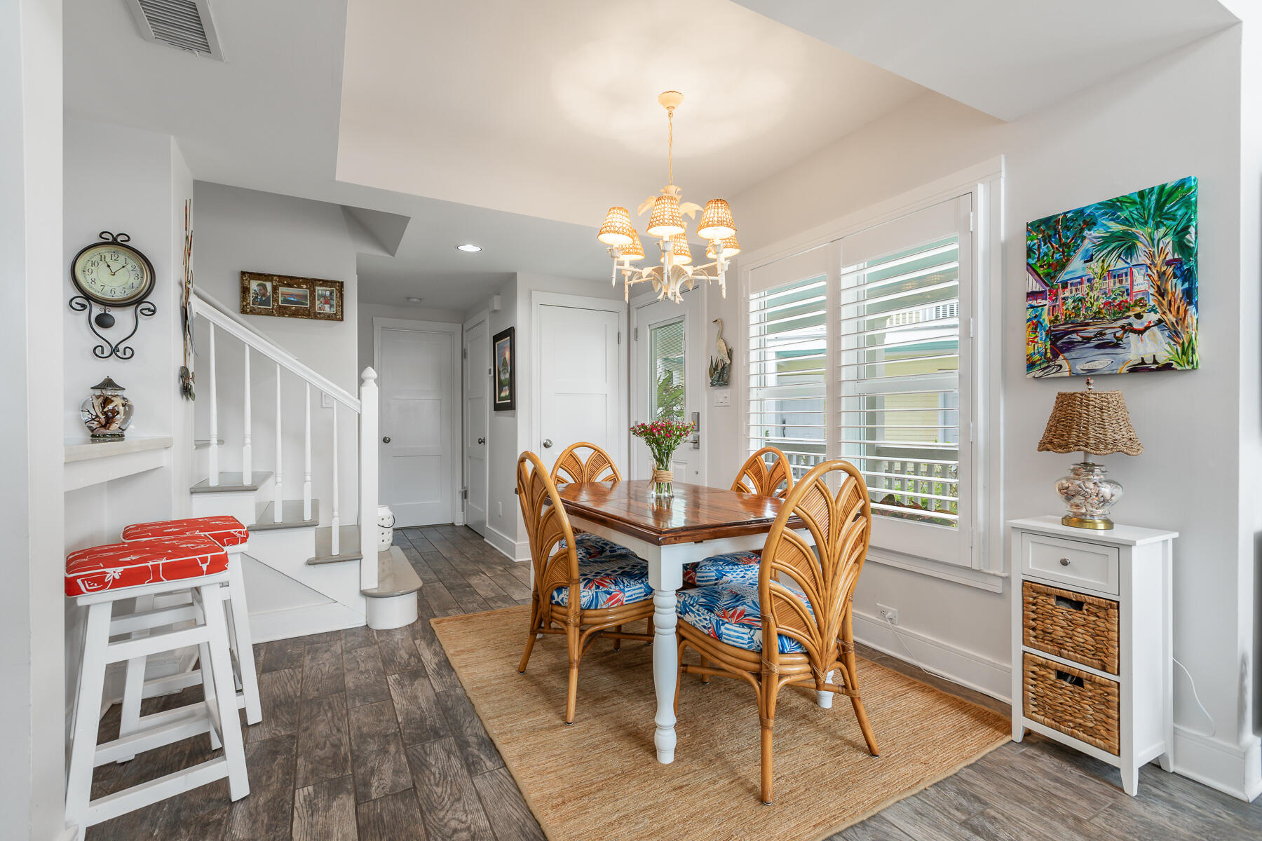 404 Porter Lane, Unit 16 Key West, FL 33040 - Photo 10 of 22 a view of a dining room with furniture and chandelier