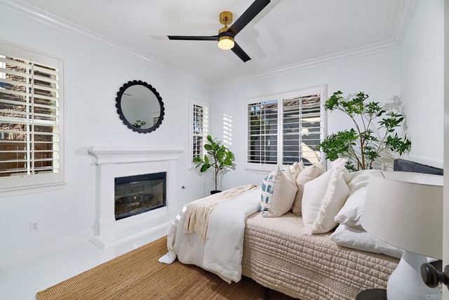 a bedroom with a bed and a fireplace