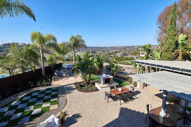 a view of a balcony with chairs and a table
