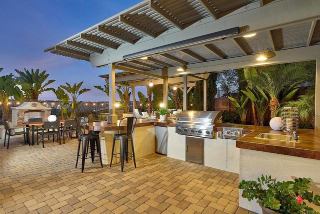 a view of a chairs and table in a patio