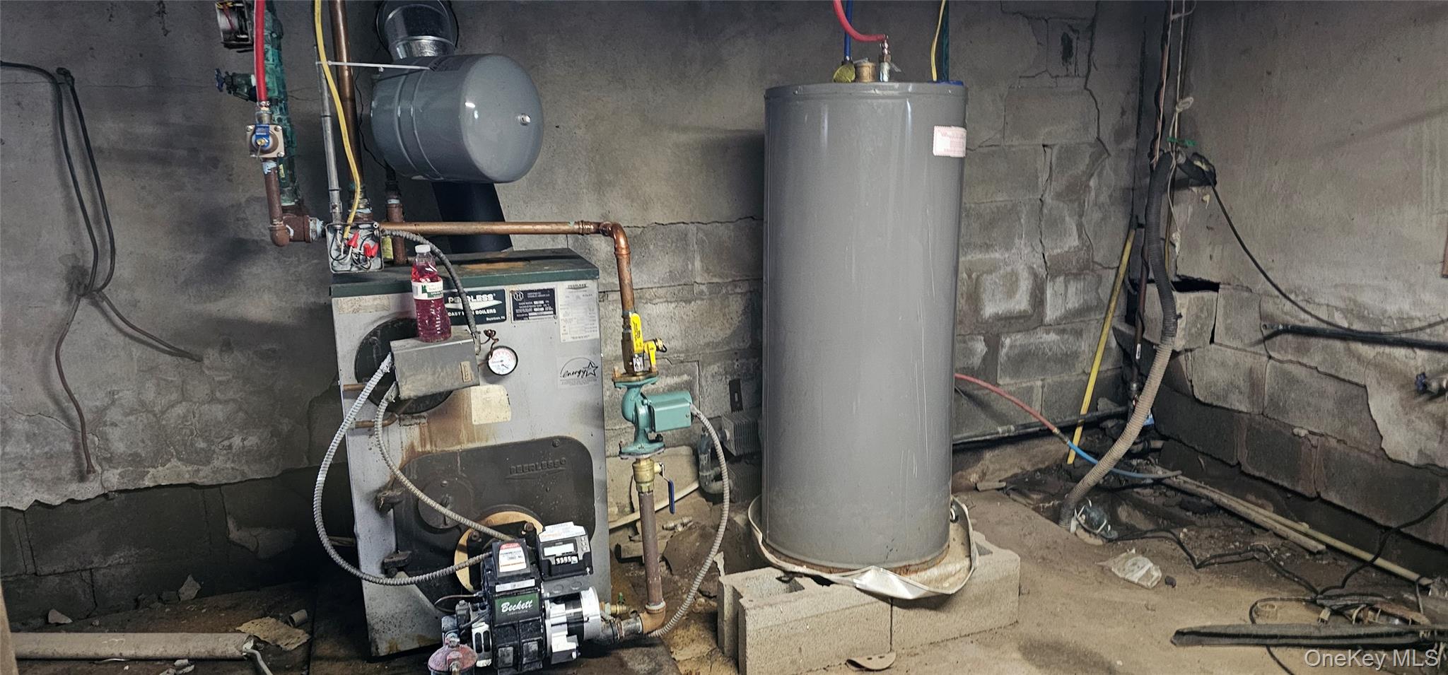 24 St Josephs Hill Road Forestburgh, NY 12777 - Photo 4 of 5 a room with water heater and wooden cabinets