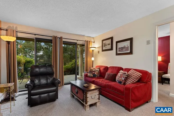 a living room with furniture and a large window