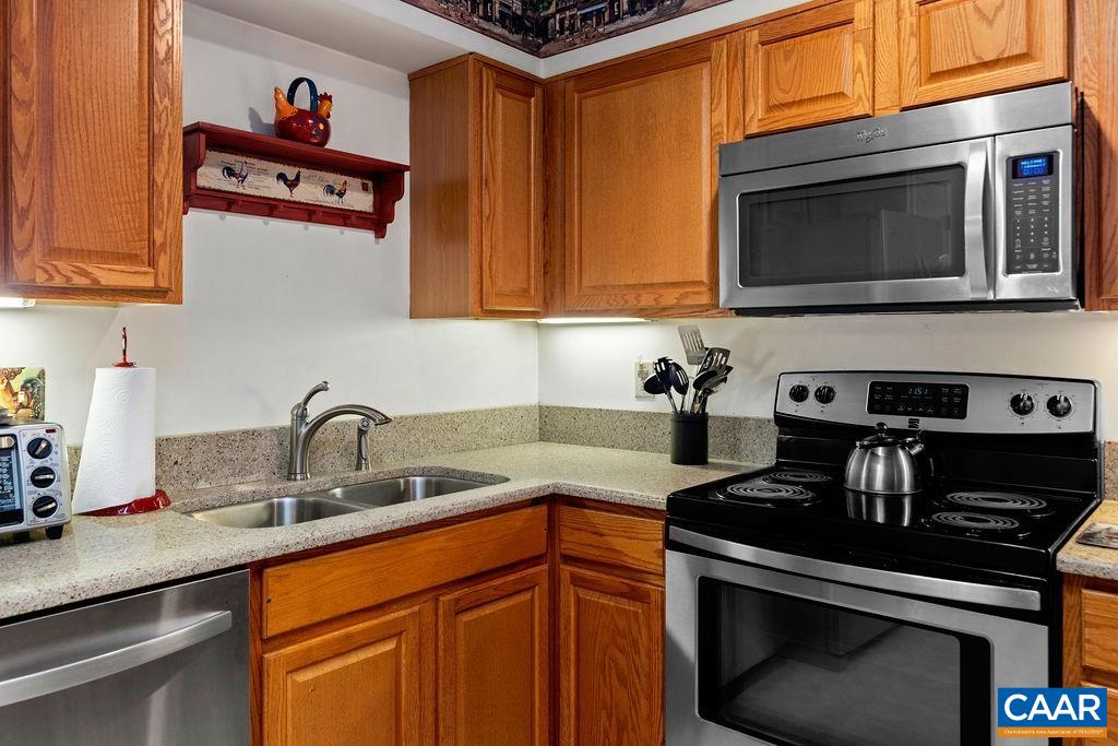 2031 Stone Ridge Wintergreen, VA 22967 - Photo 8 of 23 a kitchen with stainless steel appliances a stove and a microwave