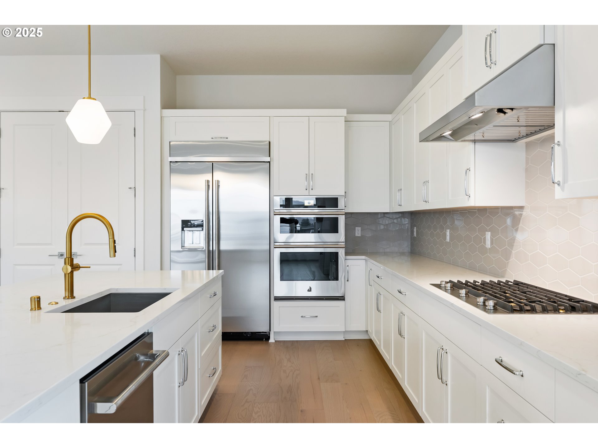 386 West Fir Loop Washougal, WA 98671 - Photo 11 of 45 a kitchen with kitchen island white cabinets and stainless steel appliances