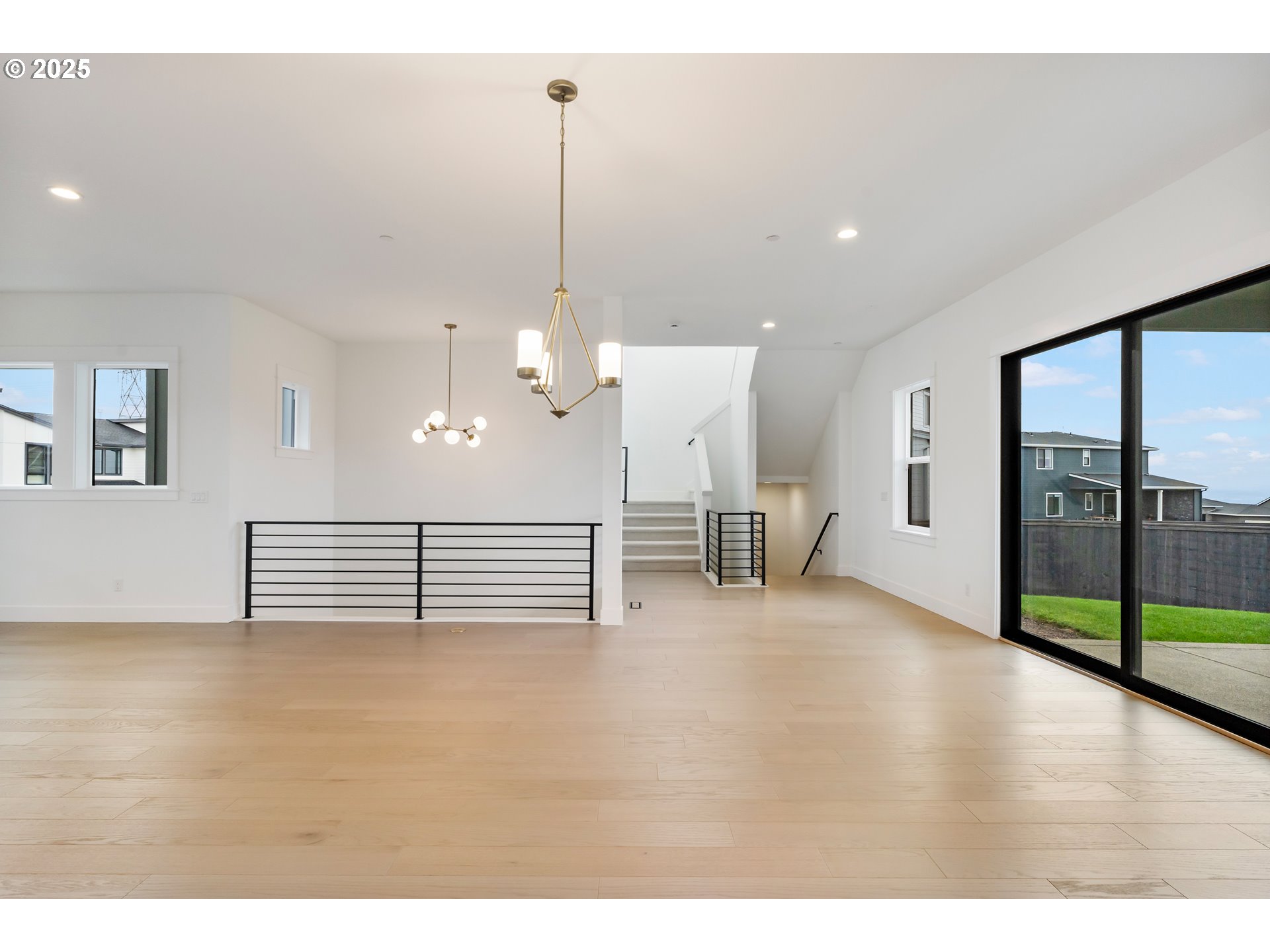 386 West Fir Loop Washougal, WA 98671 - Photo 12 of 45 a view of empty room with wooden floor