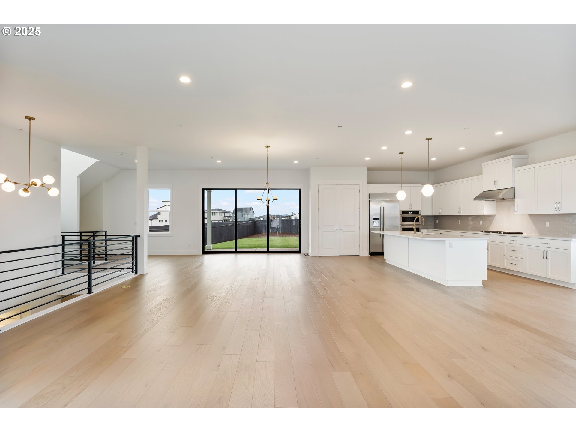 386 West Fir Loop Washougal, WA 98671 - Photo 14 of 45 a view of an empty room with kitchen counter space and a sink