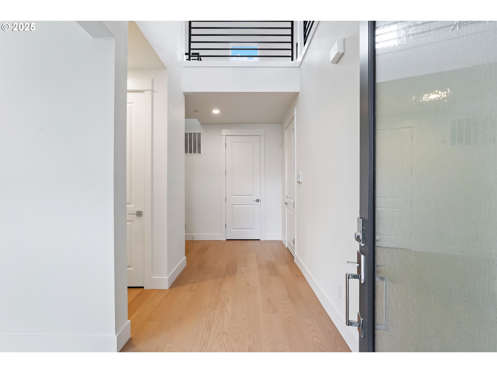 386 West Fir Loop Washougal, WA 98671 - Photo 2 of 45 a view of a hallway with wooden floor